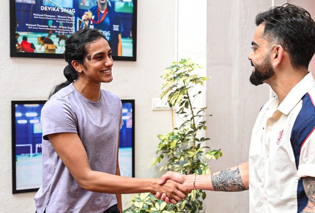 PV Sindhu and Virat Kohli sharing a moment at an event